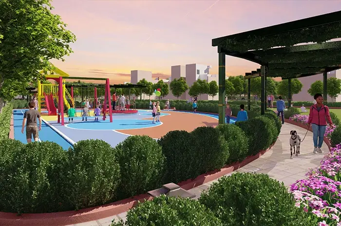 Children playing in a playground surrounded by greenery in Mansha Heritage Sonipat.